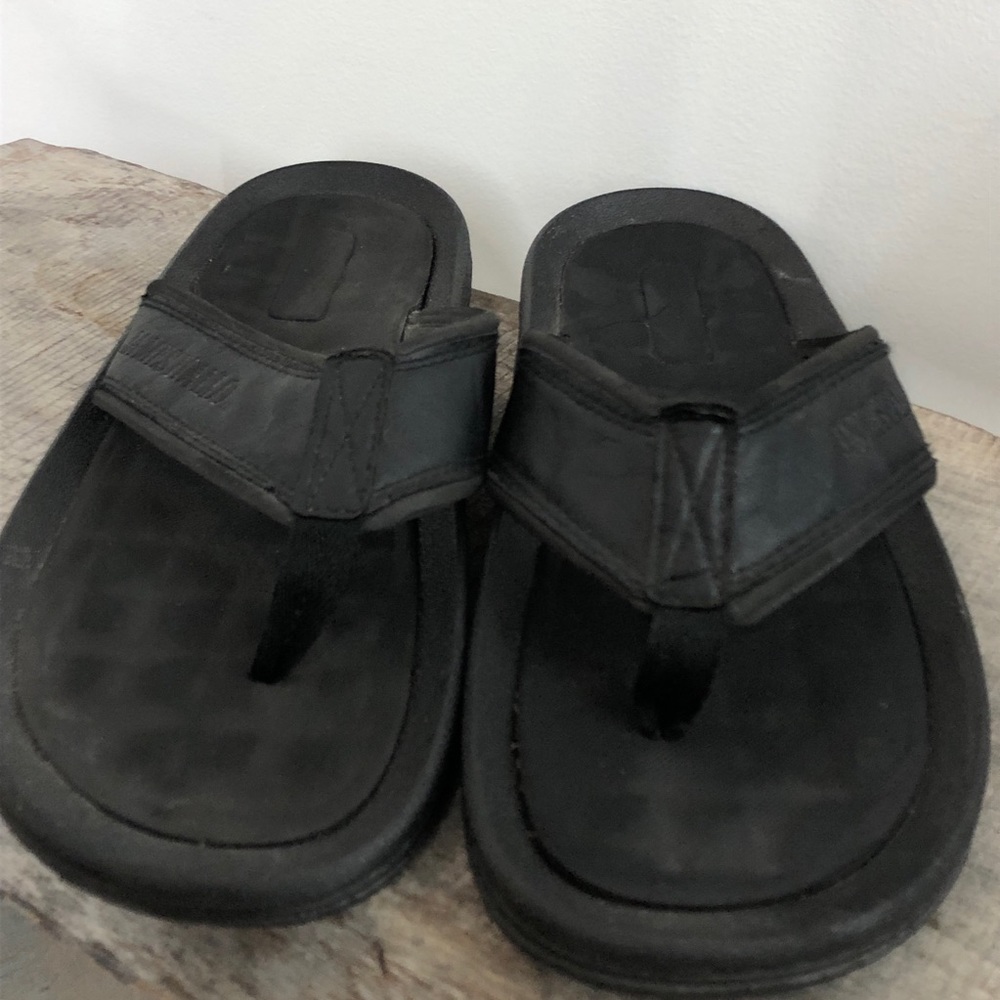 James Fiallo black flip flops